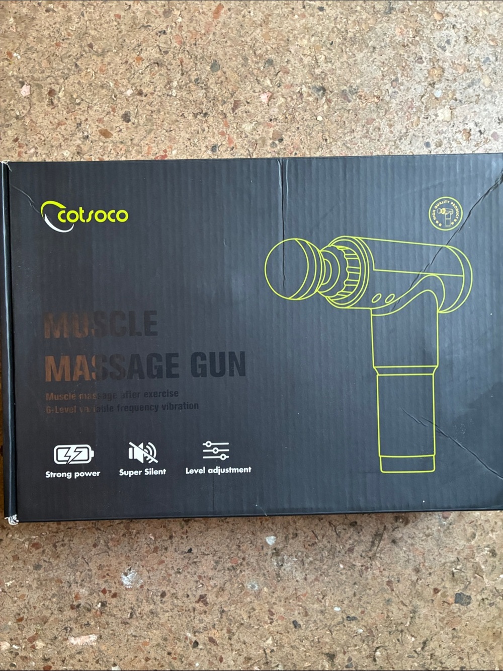Cotsoco silver and black handheld massage gun with attachments
